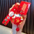 Rode Maneki Neko gelukskat sleutelhanger met roterende Fu-zak en feestelijke bel - Spinner Gelukskat / Rood