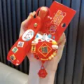 Rode Lucky Cat sleutelhanger met een roterende Fu-zak en een leuk Nieuwjaarskaartje - Spinner Gelukskat (Zwarte Editie) / Zwart