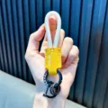 Yellow leather keychain with white woven rope loop and black metal ring accessory - White