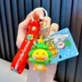 Cute Christmas yellow duck keychain featuring a festive green tree hat and red strap - Christmas Tree
