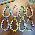 Eight sets of colorful beaded phone straps featuring butterfly charms and cartoon figures - Butterfly Boy Beaded Bracelet