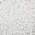 Close-up of 4mm cream white imitation jade seed beads for DIY jewelry making projects - Cream