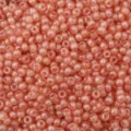 Close-up view of 4mm coral cream imitation jade seed beads for DIY jewelry making - South Red