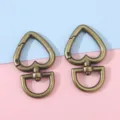 Fermoirs mousquetons en alliage en forme de cœur bronze pour porte-clés DIY et sacs - 2 Pièces/Paquet (27x44mm) / Bronze Antique