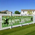 Vibrant green soccer-themed happy birthday yard banner featuring football player silhouettes - 50x300cm / Soccer Theme