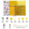 Detailed view of DIY jewelry bead set including glass seed beads, letters and elastic string - 6-Grid Yellow Series (1 Box)