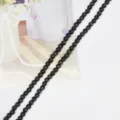 Cuentas redondas de ojo de gato negro premium para la fabricación de joyas y DIY - Negro