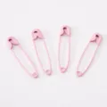 Set of four pink spray-painted safety pins for DIY crafts and garment fastening accessories - Pink