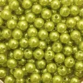 Detailed macro view of glossy olive green ABS pearl round beads for DIY jewelry crafts. - Light Green