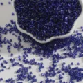 Macro shot of deep blue 2mm silver-lined bugle glass beads for DIY jewelry making projects - 2mm 15g/Pack (Approx 700 Pieces) / Sapphire Blue