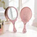 Vintage rose gold handheld vanity mirror featuring elegant embossed floral patterns - 10.5x24.6cm / Rose Gold