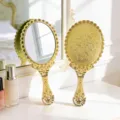 Vintage gold handheld makeup mirror with embossed floral pattern for vanity - L / Gold
