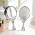 Vintage style silver electroplated handheld makeup mirror with ornate floral pattern engraving - L / Silver