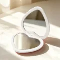 Portable heart-shaped folding compact mirror with double-sided HD glass in white finish. - White