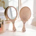 Vintage rose gold handheld makeup mirror with intricate floral pattern engraving finish - L / Rose Gold