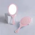 Vintage pink handheld makeup mirror with intricate floral relief pattern for girls - 9cm*19cm / Pink