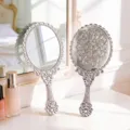 Vintage silver plated hand mirror with elegant floral embossed pattern on vanity - S / Silver