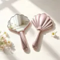 Elegant rose gold shell-shaped handheld mirror with high-definition portable design - 20x12.5cm / Electroplated Rose Gold