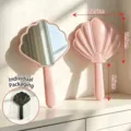 Pink shell-shaped handheld mirror with vacuum plating, portable size for makeup - 20x12.5cm / Pink