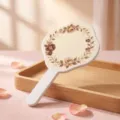 Vintage oil painting style handheld mirror with rose floral pattern and white wavy handle - Retro Brown Rose Wreath / 12x20cm