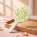Vintage Chinese style handheld makeup mirror with colorful floral pattern on a wooden tray - Peony Pattern