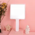 Large pink square handheld makeup mirror with an ergonomic portable handle for salon - 9cm*16cm / White