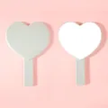 Minimalist heart-shaped handheld makeup mirror with sleek light grey plastic frame design - 13cm*18cm / Green