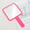 Portable square handheld makeup mirror featuring a vibrant pink plastic frame handle - 9cm*16cm / Rose Red