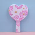 Detail view of heart-shaped handheld mirror featuring a delicate pink floral pattern design - 12.5cm*18cm / Perfect Reunion (Flowers & Moon)