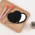Portable black heart-shaped rotating double-sided compact mirror with hanging chain. - 8*9 Rotating Heart Mirror / Black