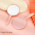 Premium pink handheld round makeup mirror with plastic handle, size 7.5x13.5cm. - 5.5x10cm / Pink