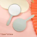 Small circular handheld makeup mirror in mint green finish measuring 7.5x13.5cm for beauty - 5.5x10cm / Light Blue