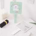 Cute mint green cartoon dog hand-held makeup mirror with white variant on a table - 9*16cm / Cute Dog