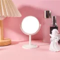 Minimalist white round desktop makeup mirror with rotating stand on a pink vanity desk - Round Double Sided Mirror - Medium / Creamy White One Side Magnification