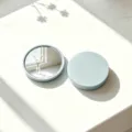 High-definition round portable makeup mirror in pale blue finish with back and front view - Blue