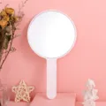 Large pink handheld round makeup mirror with a portable ergonomic handle design - 12cm*21cm / White