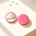 High-definition portable round compact makeup mirror in matte pink finish for travel - Rose Red
