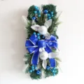 Christmas teardrop swag wreath featuring a large blue glitter bow and silver ornaments - New Blue