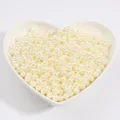 Perle finte in ABS bianco crema in un piatto a cuore per gioielli fai-da-te - 2mm (1000 Pezzi/Confezione) / Beige