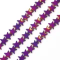 Detail view of star-shaped beads with a purple and gold electroplated gradient finish - Purple