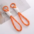 Handgefertigter orange-weißer Polyester-Seilschlüsselanhänger mit orangefarbenem Legierungsring - 1 Stück / Orange