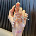 Handgefertigter lila Perlen Handy-Anhänger mit glitzernder Kristallschleife und Schmetterling - Legierung Schmetterling Laterne / Lila