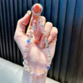 Iridescent sugar cube crystal beaded phone charm wrist strap with silver clasp - Pink