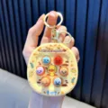 Mini llavero de juego de atrapar al topo amarillo con pato y botones de colores - Amarillo