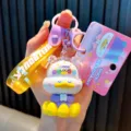 Cute meditating cartoon duck keychain with purple strap and 'Good Luck' charm - Yellow