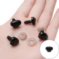 Black plastic safety noses and eyes for plush toys with clear washers held in a palm - Dotted Threaded Nose / 12x15mm (30 Pairs/Pack) / Black