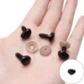 Black heart-shaped safety eyes for plush toys with washers shown in hand - Triangular Threaded Accessory / 10x13mm (30 Pairs/Pack) / Black