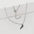 Close-up view of a stainless steel necklace featuring a black chili cornicello lucky pendant - 45+5cm / Black