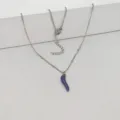 Detailed view of a stainless steel necklace with a minimalist blue chili pepper pendant. - 45+5cm / Dark Blue