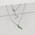 Detailed view of stainless steel necklace with vibrant green chili pepper pendant. - 45+5cm / Verdant